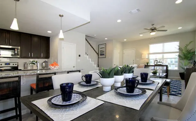 a kitchen with a table and chairs in it