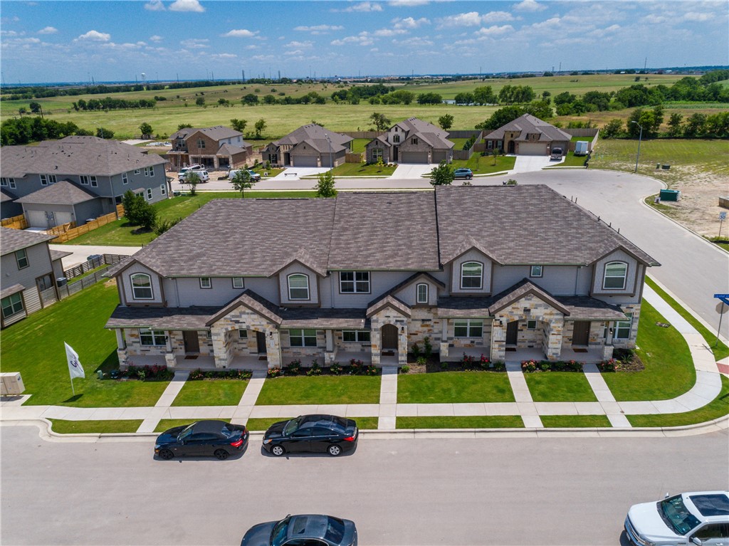 708 Tinton Falls Lane Pflugerville, TX 78660 - Photo 2 of 40 an aerial view of a house with a swimming pool yard and outdoor seating