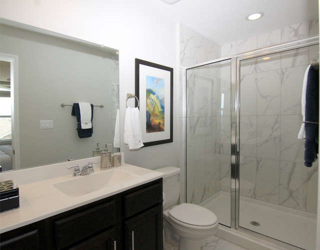 708 Tinton Falls Lane Pflugerville, TX 78660 - Photo 26 of 40 a bathroom with a sink a toilet and shower