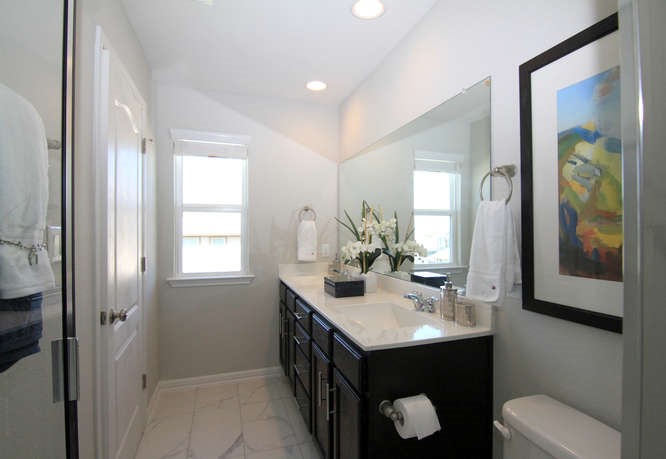 708 Tinton Falls Lane Pflugerville, TX 78660 - Photo 28 of 40 a bathroom with a sink vanity and a mirror