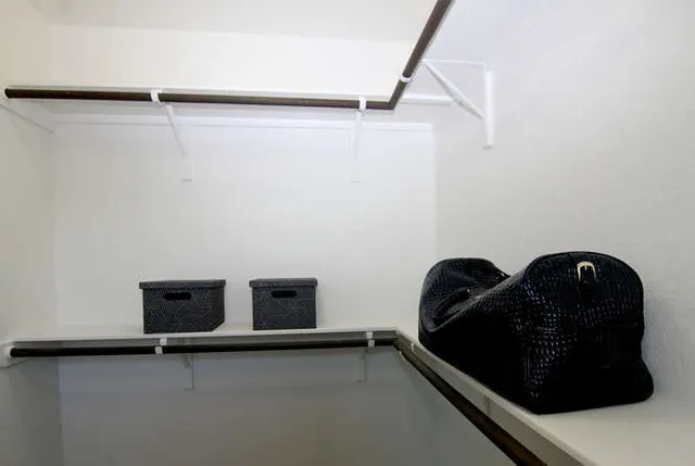 a table with wooden floor and shoes