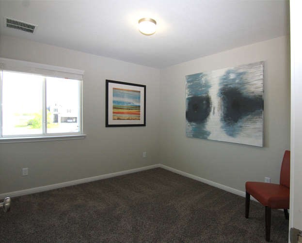 708 Tinton Falls Lane Pflugerville, TX 78660 - Photo 33 of 40 a view of room with window and chair