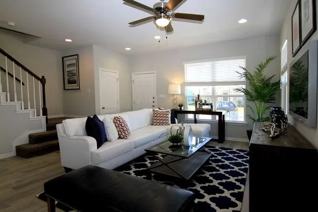 a living room with furniture and a rug