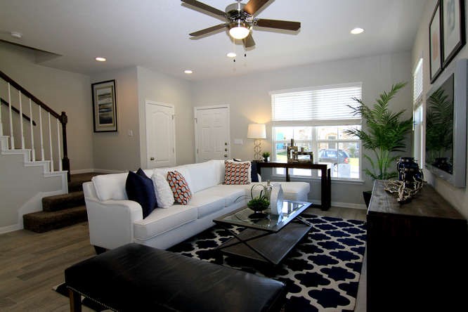 708 Tinton Falls Lane Pflugerville, TX 78660 - Photo 6 of 40 a living room with furniture and a rug