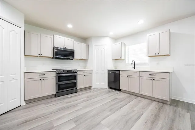 a view of a hallway with stairs