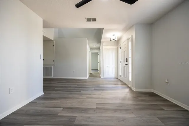a kitchen with stainless steel appliances and white cabinets