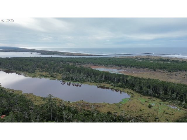 4 Bonnett Way Florence, OR 97439 - Photo 14 of 17 a view of lake with mountain in background