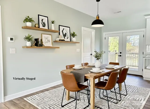 a view of a dining room with furniture window and wooden floor