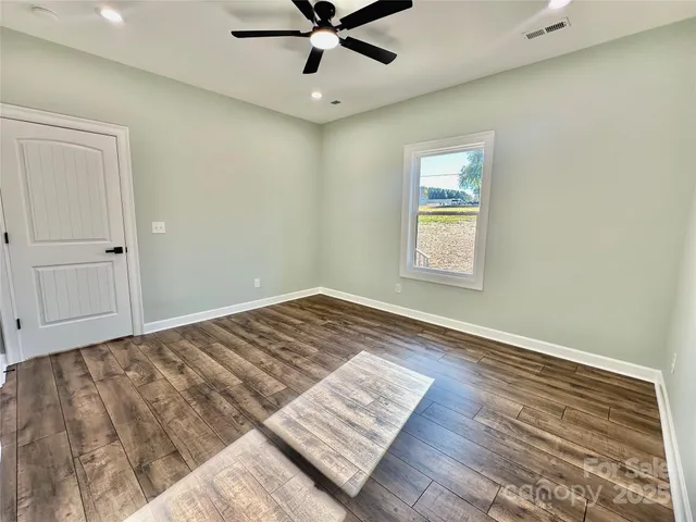a view of an empty room and window