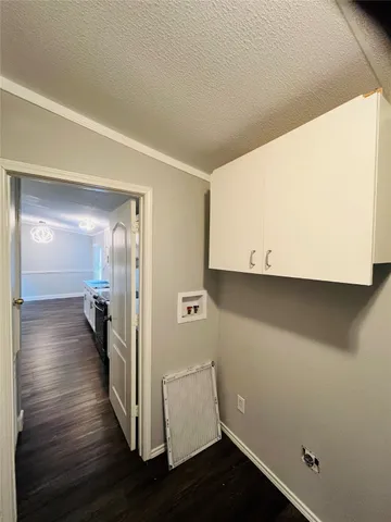 a view of a room with wooden floor