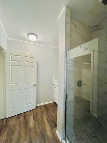 a bathroom with a shower and toilet