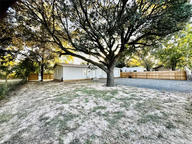 a house with trees in front of it