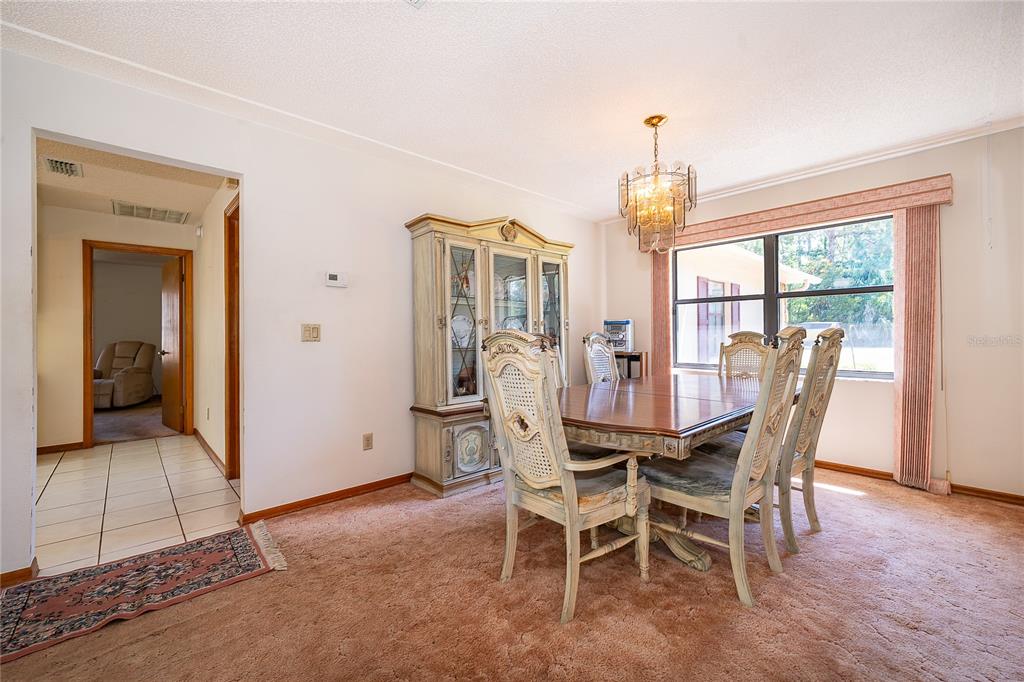 14604 Southwest 45th Circle Ocala, FL 34473 - Photo 13 of 28 a view of a dining room with furniture window and outside view