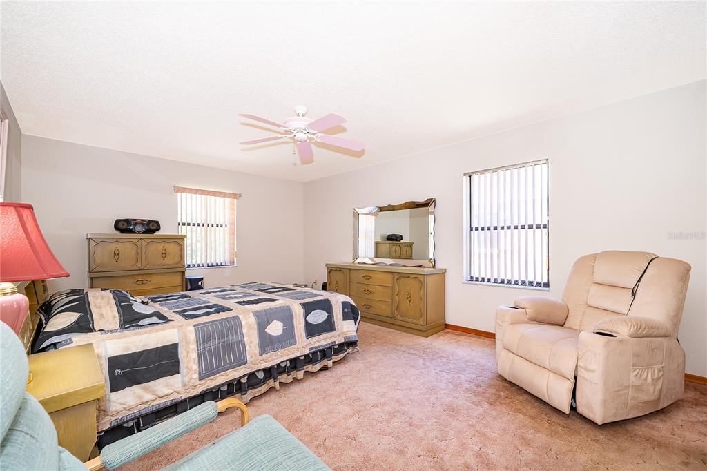 14604 Southwest 45th Circle Ocala, FL 34473 - Photo 19 of 28 a bedroom with furniture and a window