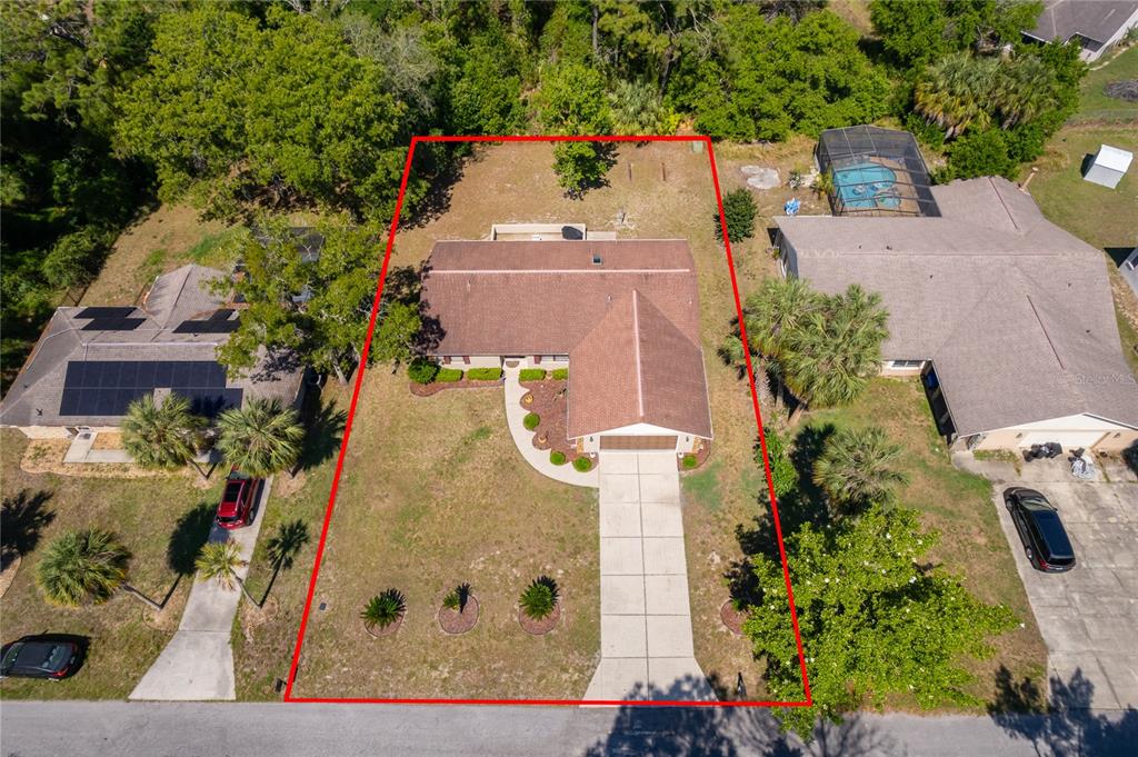 14604 Southwest 45th Circle Ocala, FL 34473 - Photo 2 of 28 an aerial view of a house with a yard