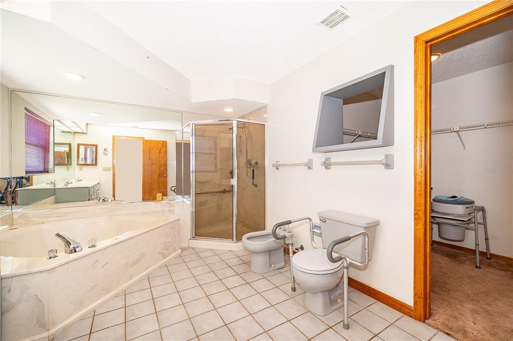 14604 Southwest 45th Circle Ocala, FL 34473 - Photo 21 of 28 a bathroom with a bathtub sink and toilet