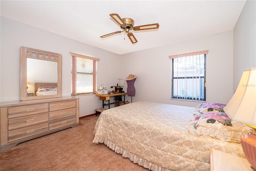 14604 Southwest 45th Circle Ocala, FL 34473 - Photo 23 of 28 a bedroom with a bed and a window