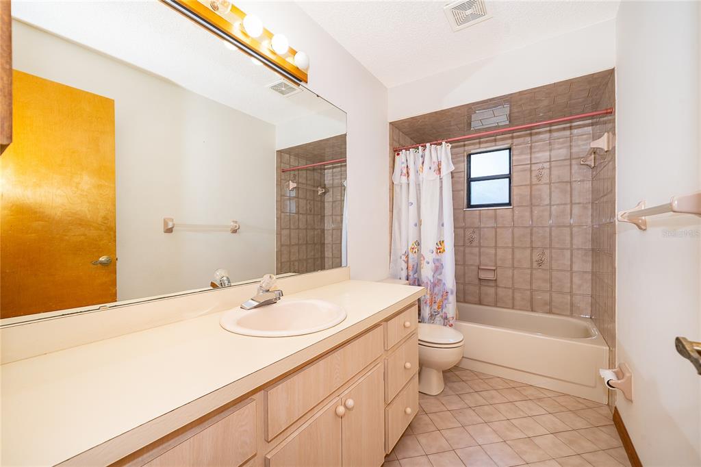 14604 Southwest 45th Circle Ocala, FL 34473 - Photo 24 of 28 a bathroom with a sink a toilet and shower