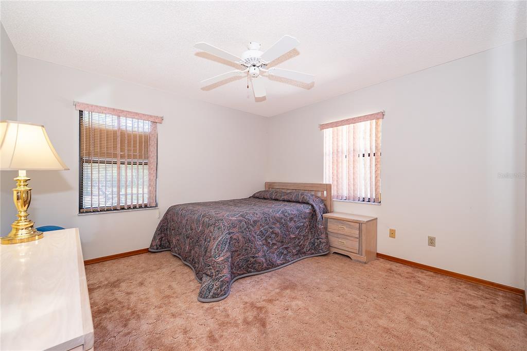 14604 Southwest 45th Circle Ocala, FL 34473 - Photo 25 of 28 a bedroom with a bed and a window