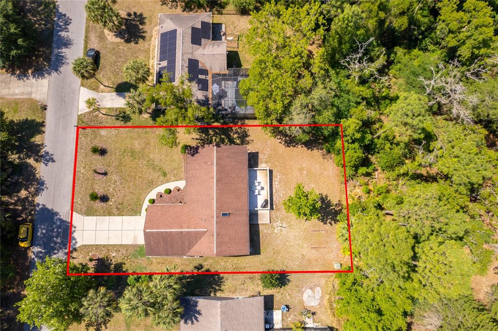14604 Southwest 45th Circle Ocala, FL 34473 - Photo 3 of 28 an aerial view of a house with a yard and garden