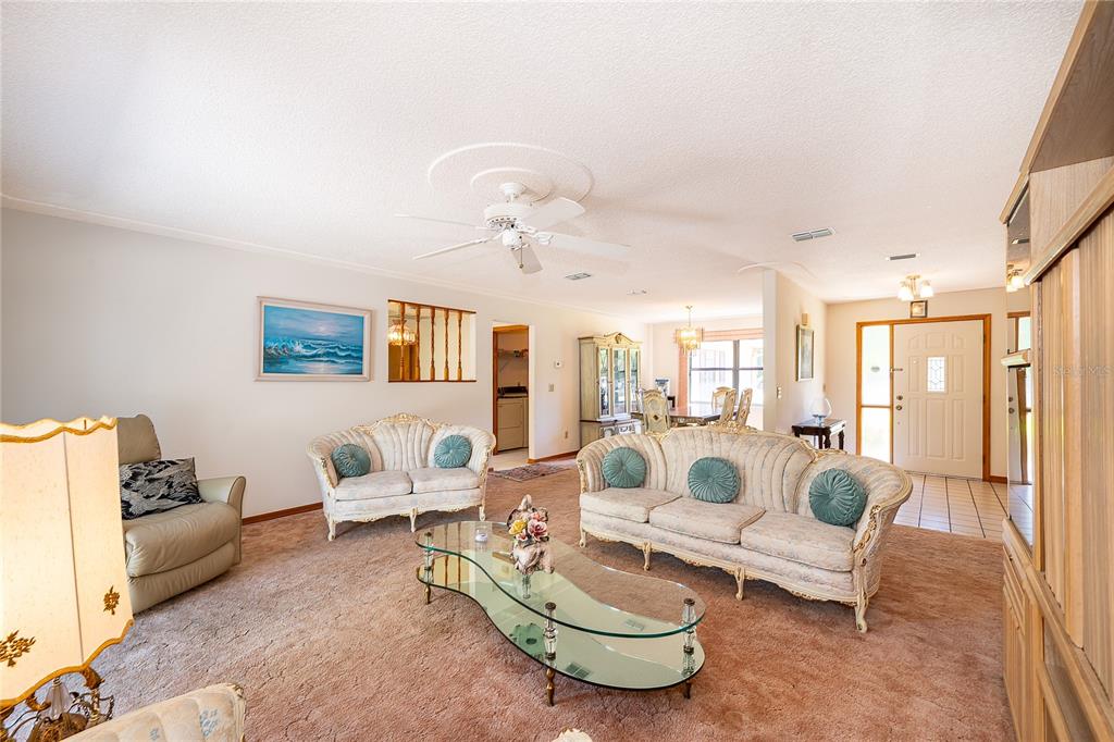 14604 Southwest 45th Circle Ocala, FL 34473 - Photo 10 of 28 a living room with furniture and a large window