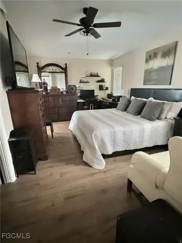 a bedroom with bed and window