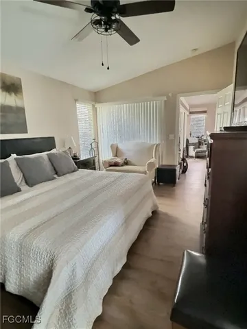 a bathroom with double vanity sinks a toilet a tub and a mirror