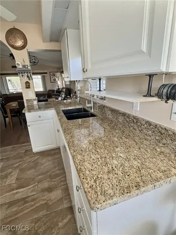 a dining room with furniture window and wooden floor