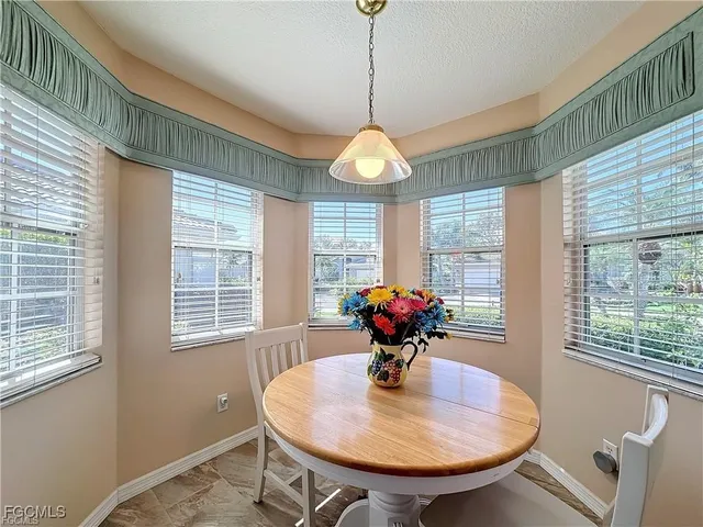 a spacious bedroom with a bed and furniture