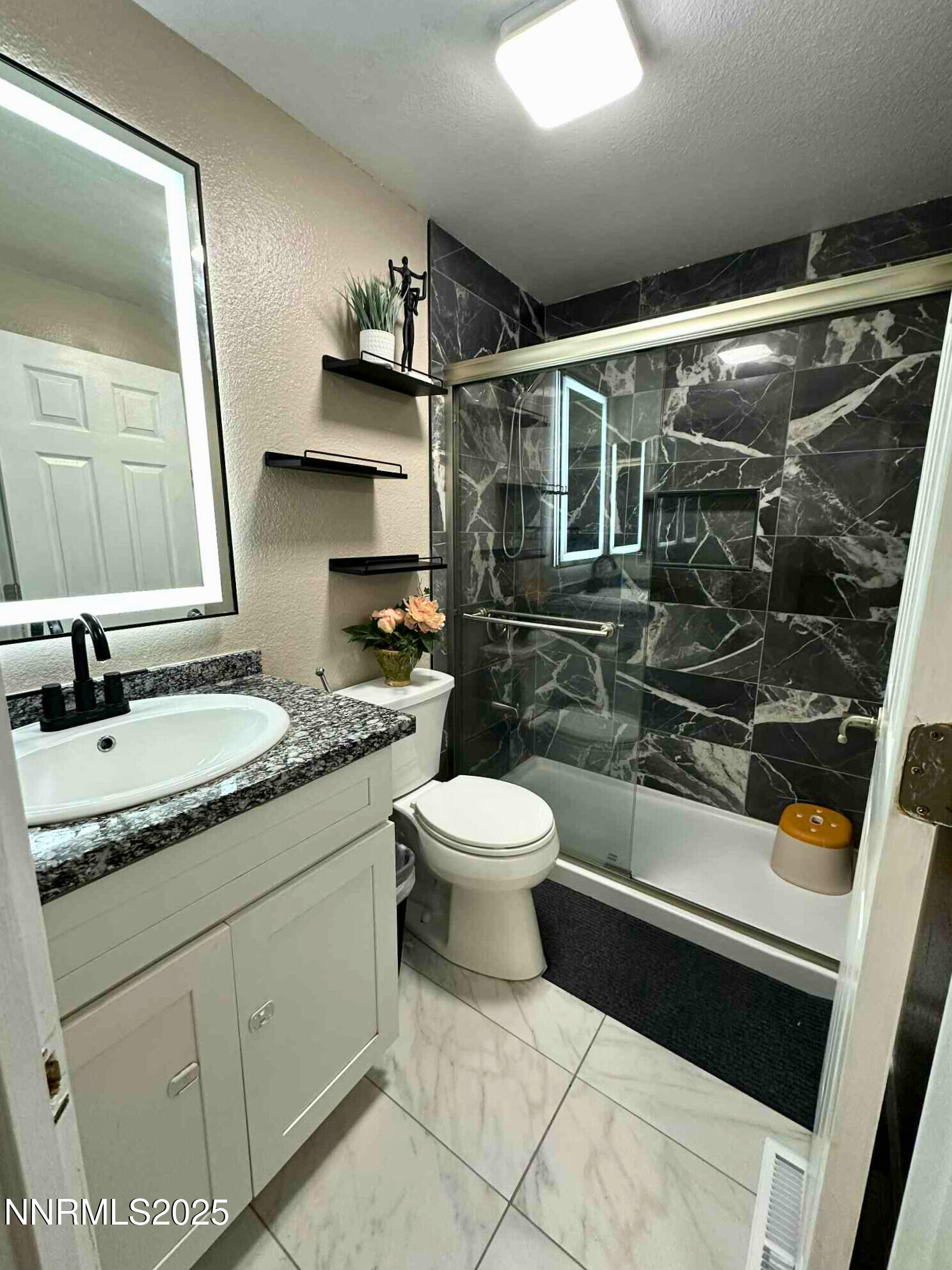 1725 Catham Lane Sparks, NV 89434 - Photo 3 of 4 a bathroom with a granite countertop sink toilet and shower