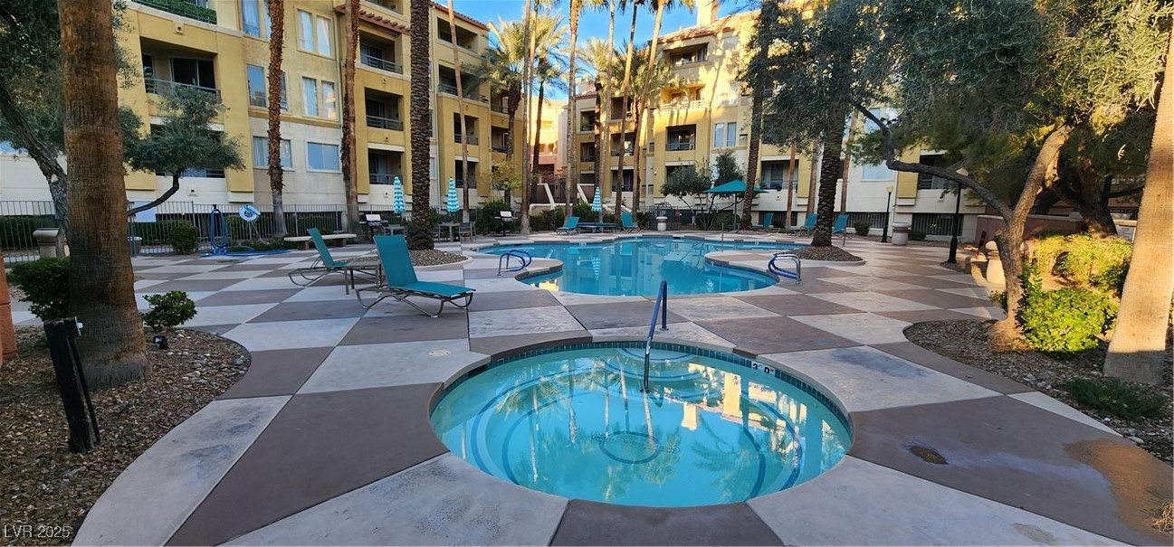 210 East Flamingo Road, Unit 326 Las Vegas, NV 89169 - Photo 27 of 58 View from stairs leading to subject unit showing adjacent pool.