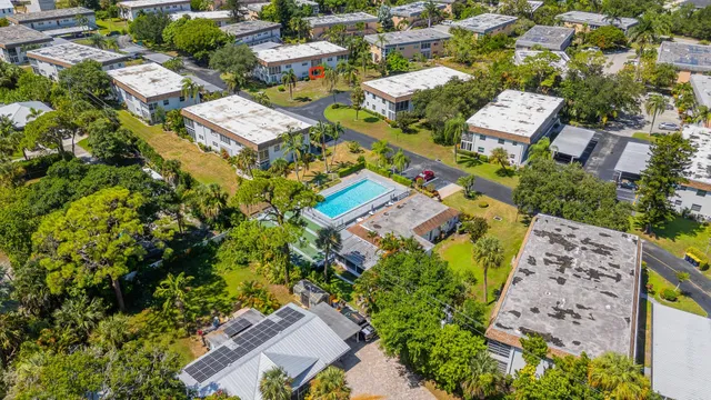 an aerial view of residential houses with outdoor space
