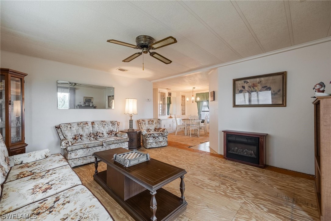 27 Aloe Alva, FL 33920 - Photo 11 of 33 a living room with furniture and a fireplace