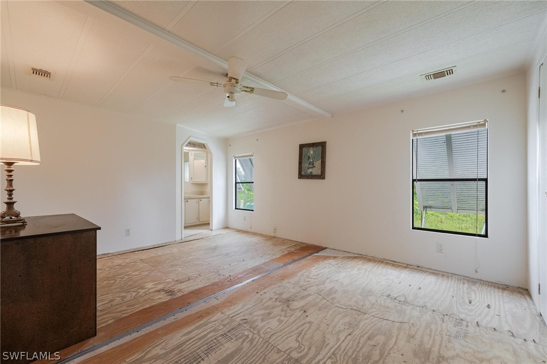 27 Aloe Alva, FL 33920 - Photo 17 of 33 wooden floor in an empty room with a window