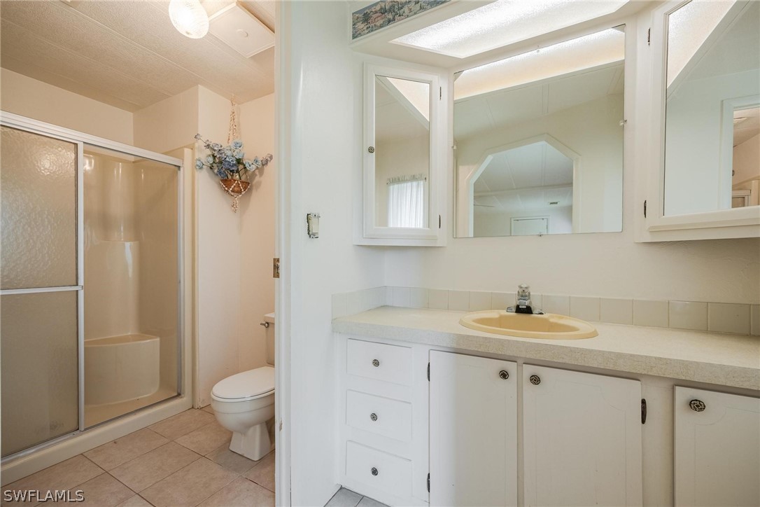 27 Aloe Alva, FL 33920 - Photo 20 of 33 a bathroom with a sink a toilet and shower