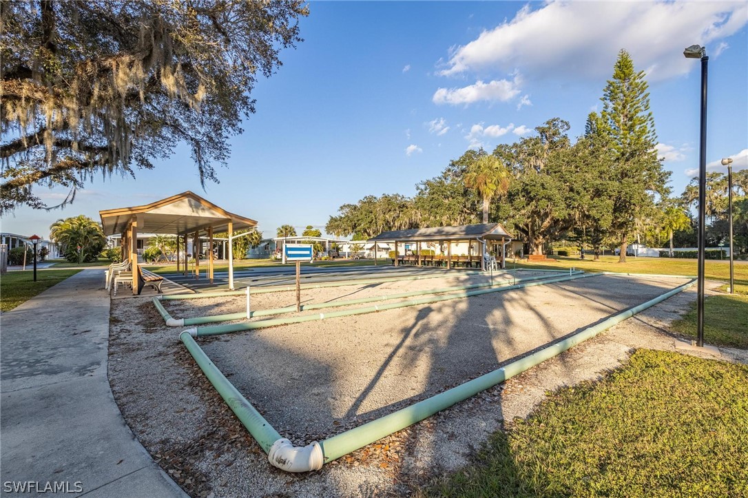 27 Aloe Alva, FL 33920 - Photo 30 of 33 a view of a swimming pool with an outdoor seating