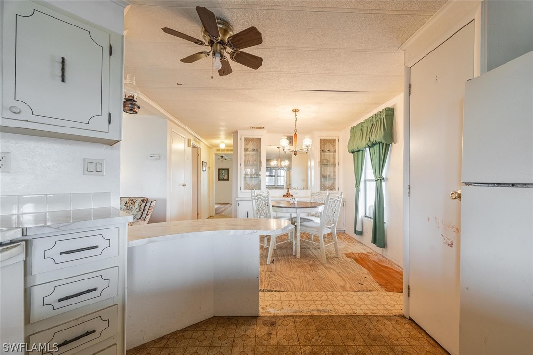 27 Aloe Alva, FL 33920 - Photo 4 of 33 a large white kitchen with a window and furniture
