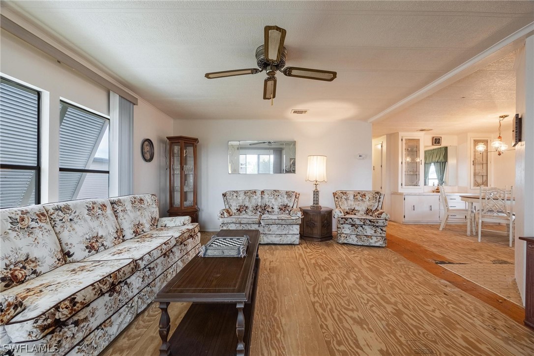 27 Aloe Alva, FL 33920 - Photo 10 of 33 a living room with furniture and a large window