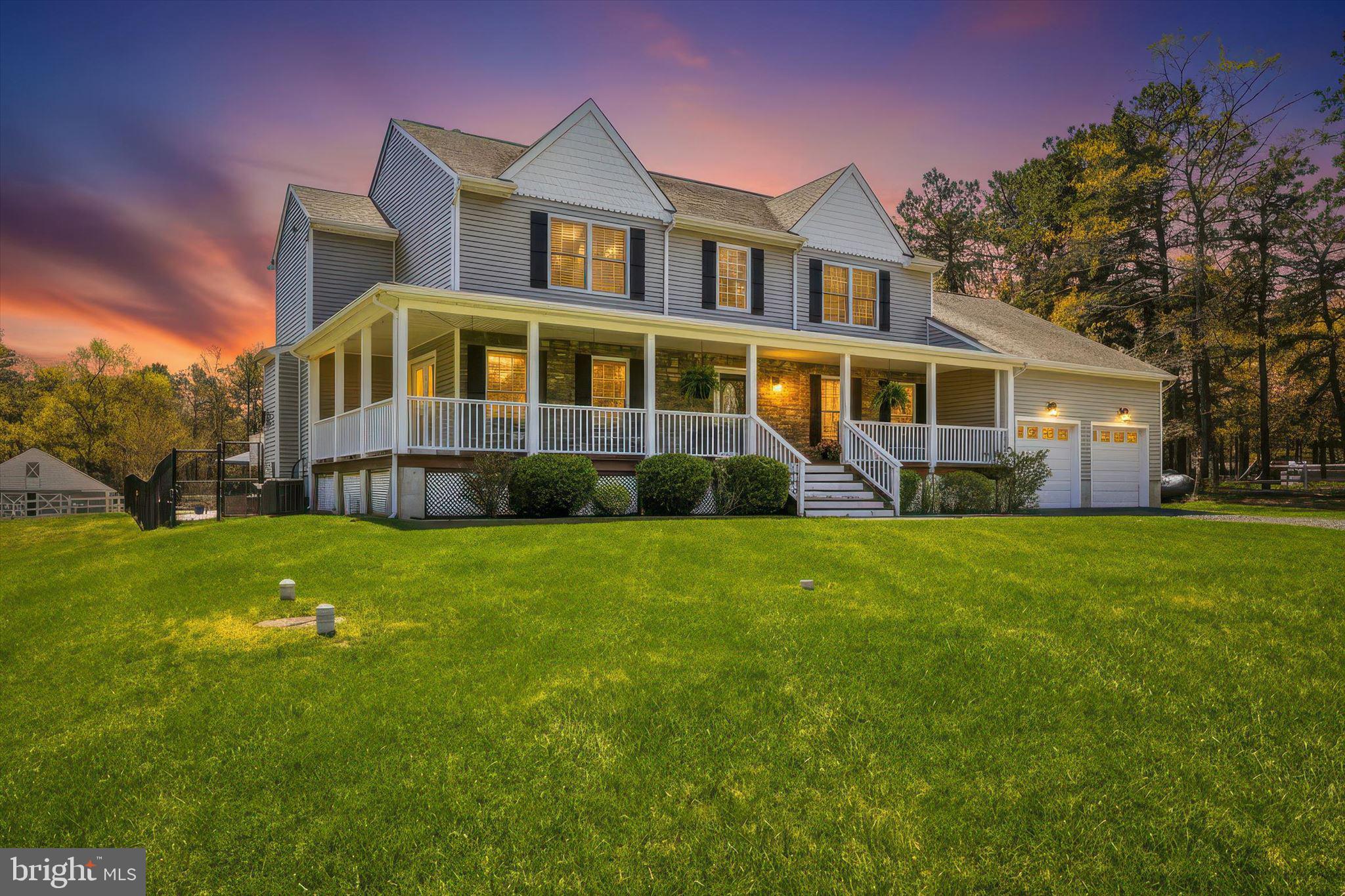 176 Warren Grove Road Barnegat, NJ 08005 - Photo 2 of 71 a front view of a house with a garden and trees