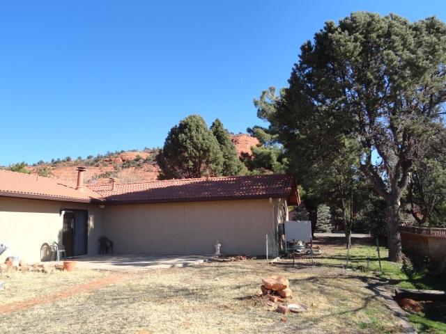 2175 Lariat Road Sedona, AZ 86336 - Photo 5 of 10 a house with trees in the background