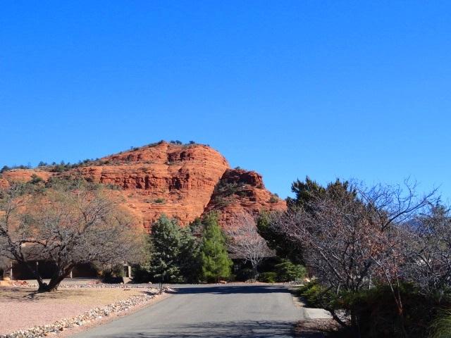 2175 Lariat Road Sedona, AZ 86336 - Photo 9 of 10 a view of a building with mountains in the background