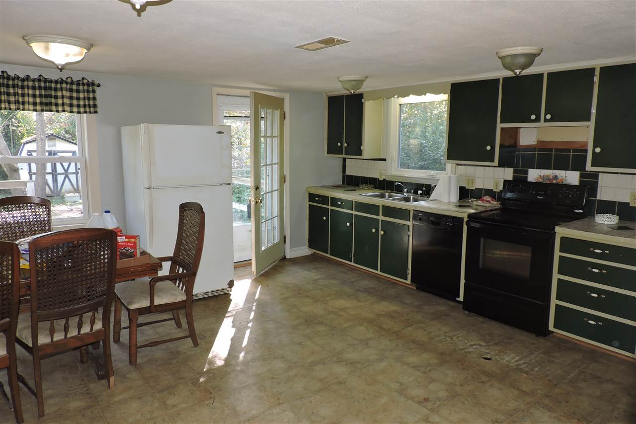 2134 Mt Torrey Road Lyndhurst, VA 22952 - Photo 11 of 32 a kitchen with cabinets and chairs