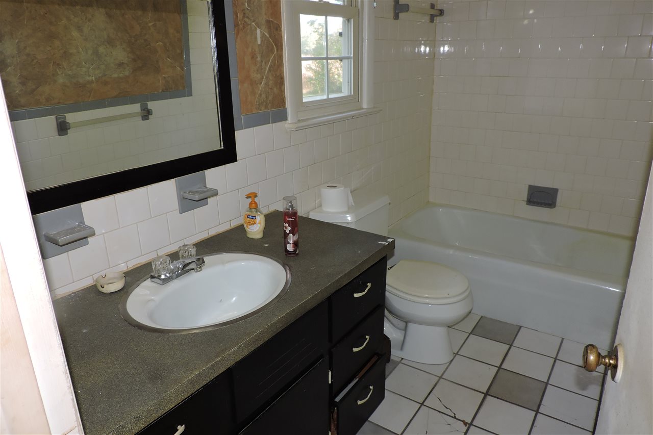 2134 Mt Torrey Road Lyndhurst, VA 22952 - Photo 15 of 32 a bathroom with a sink a toilet and mirror