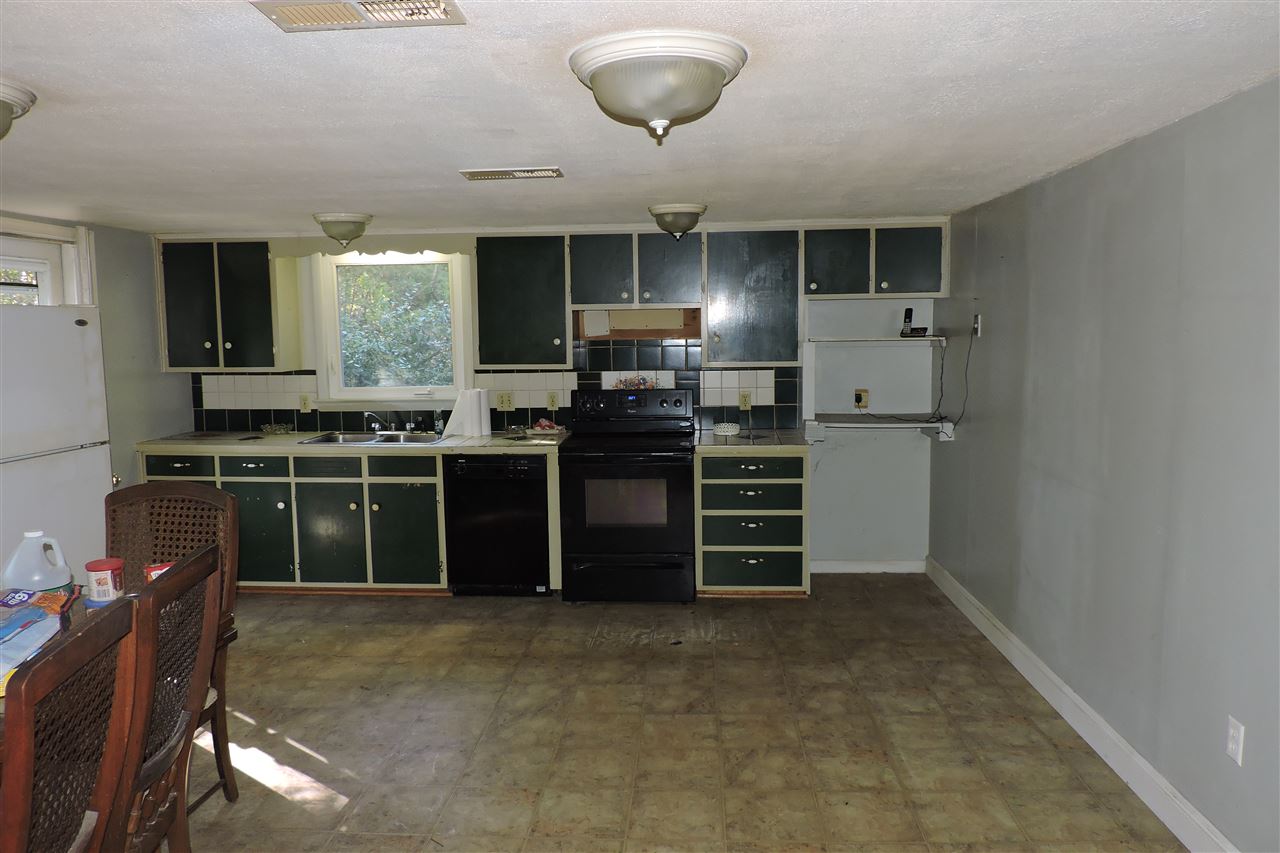 2134 Mt Torrey Road Lyndhurst, VA 22952 - Photo 16 of 32 a kitchen with stainless steel appliances a stove and more cabinets