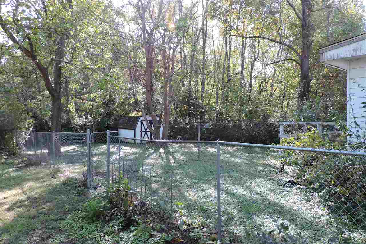 2134 Mt Torrey Road Lyndhurst, VA 22952 - Photo 6 of 32 a backyard of a house with trees and outdoor seating