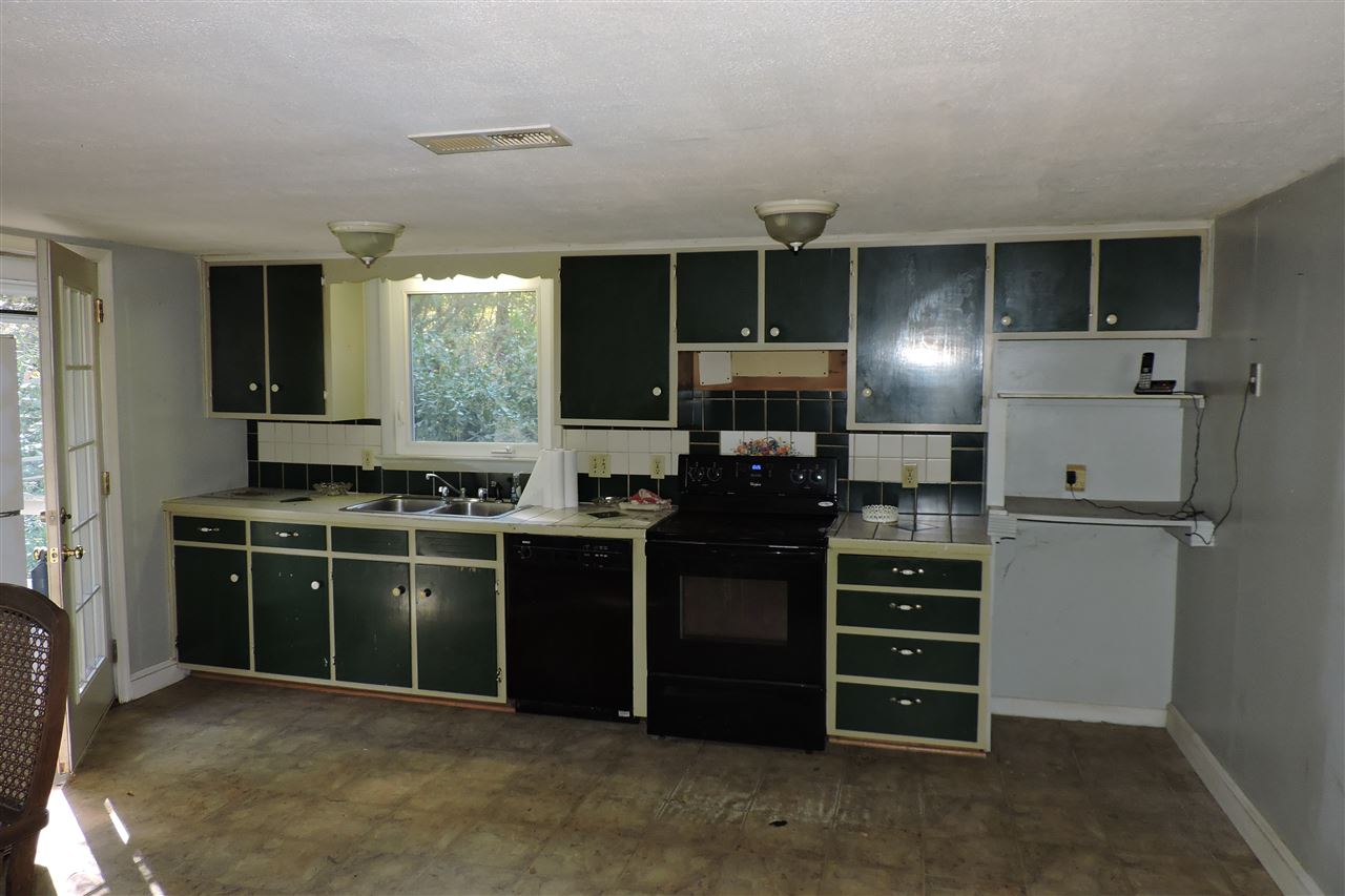 2134 Mt Torrey Road Lyndhurst, VA 22952 - Photo 9 of 32 a kitchen with stainless steel appliances kitchen island granite countertop a refrigerator stove and sink
