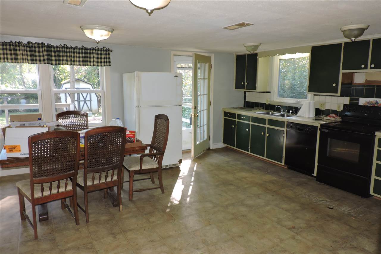 2134 Mt Torrey Road Lyndhurst, VA 22952 - Photo 10 of 32 a kitchen with stainless steel appliances granite countertop a stove a refrigerator a table and chairs