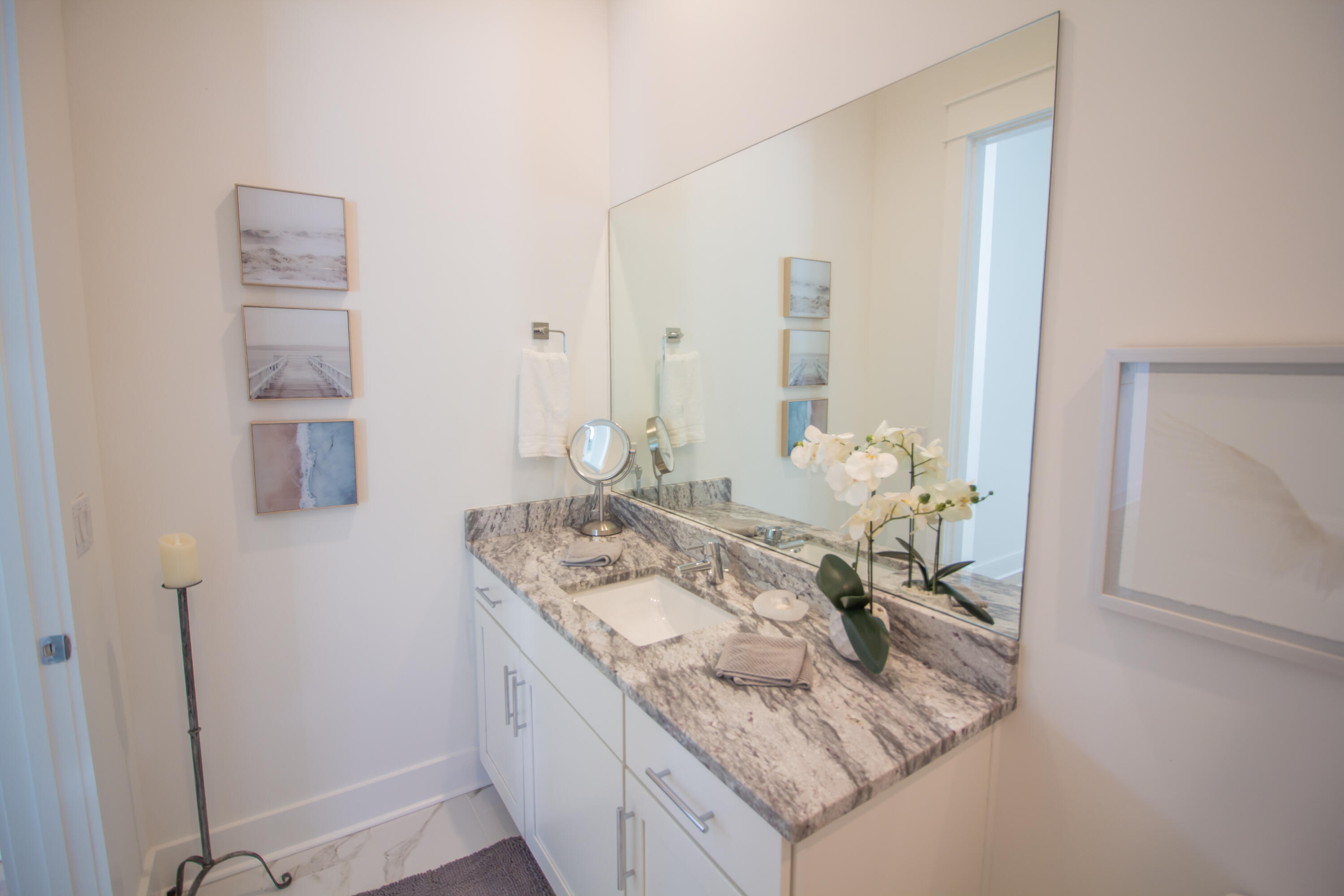 141 Valdare Ln Inlet Beach Inlet Beach, FL 32461 - Photo 11 of 55 a bathroom with a granite countertop sink and a mirror