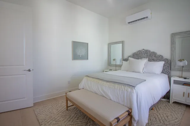 a large white kitchen with a large window