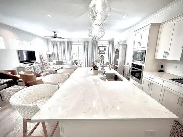 a large kitchen with a table and chairs